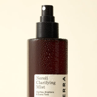 Apoterra Neroli Clarifying Complexion Mist bottle covered is water droplets