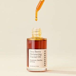 Apoterra Sea Berry Balancing Facial Oil with dropper showing the rich, liquid gold color of the facial oil