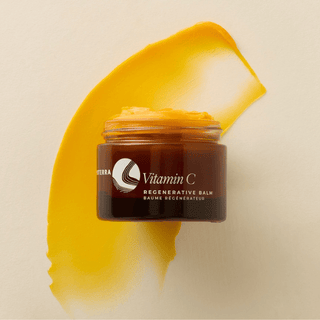 Apoterra Vitamin C Balm jar and texture swipe showing rich, golden texture