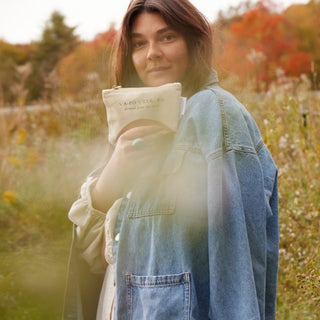 Woman holding Apoterra's best selling Discovery Kit bag in hand