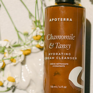 Apoterra Chamomile Tansy Hydrating Cream Cleanser for sensitive skin product bottle photo with chamomile flowers