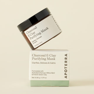 charcoal and clay purifying mask jar on top of its box