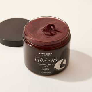 Jar of Apoterra Skincare Hibiscus Exfoliating Mask jar open showing texture