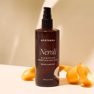 Apoterra Neroli Clarifying Complexion Mist sitting with orange peel