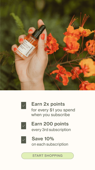 Text explaining the benefits of joining the loyalty program next to a hand holding a facial oil bottle in a natural setting surrounded by orange flowers. 