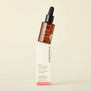 Rose Nourishing Facial Oil bottle stacked on Apoterra box with firms, hydrates & protects text. 