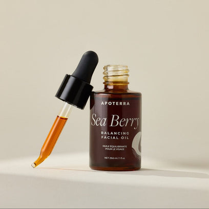 Sea Berry Balancing Facial Oil with dropper showing the rich, liquid gold color of the facial oil