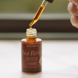 Apoterra's Sea Berry Balancing Facial Oil bottle and dropper lifestyle image